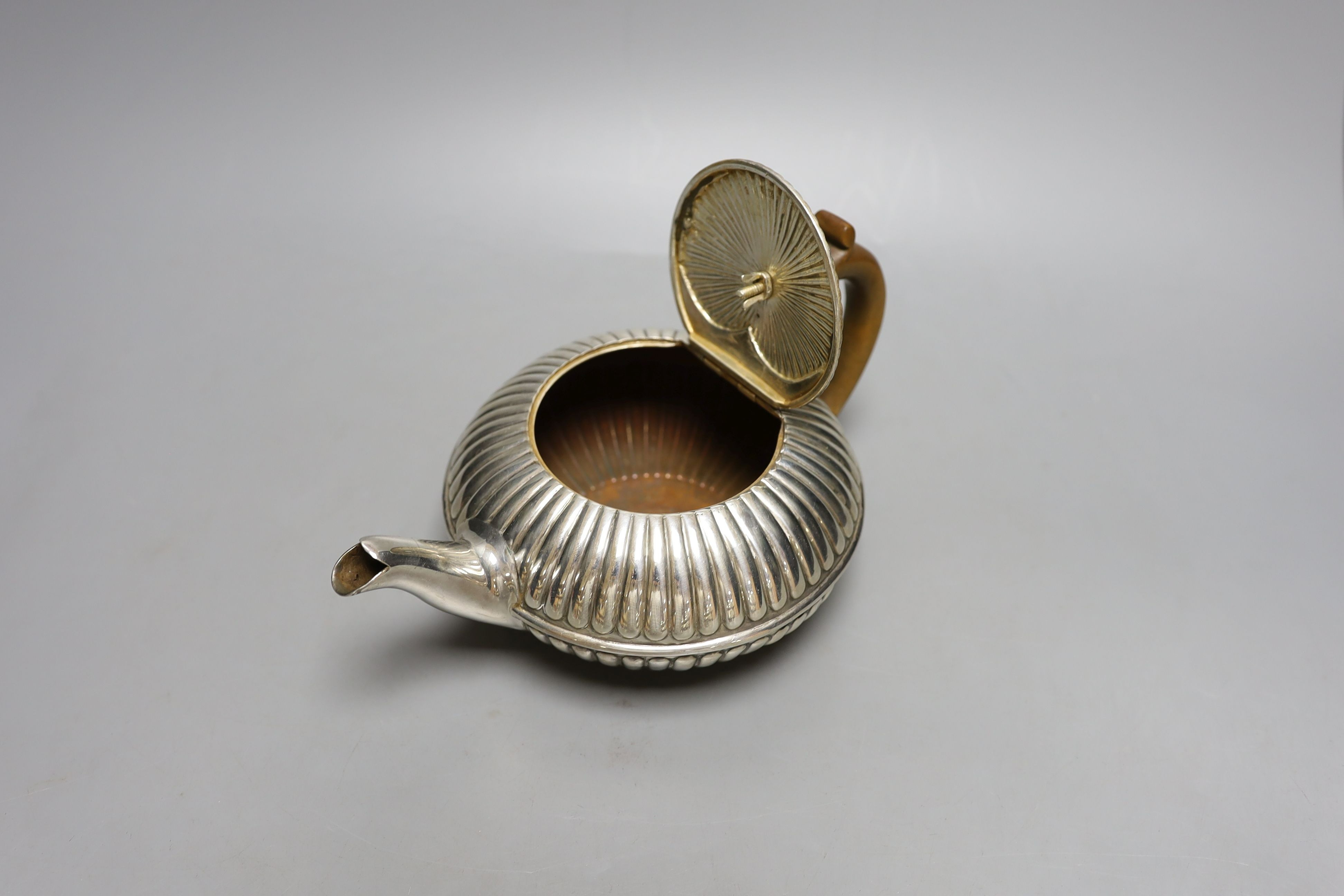 A George IV fluted silver teapot, Emes & Barnard, London, 1825, gross 13.5 oz.